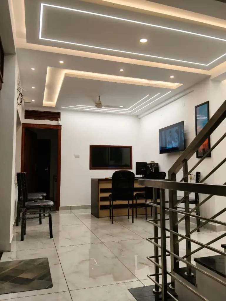 Modern and bright reception area at Amelia Ladies Hostel in Kakkanad, Kochi.