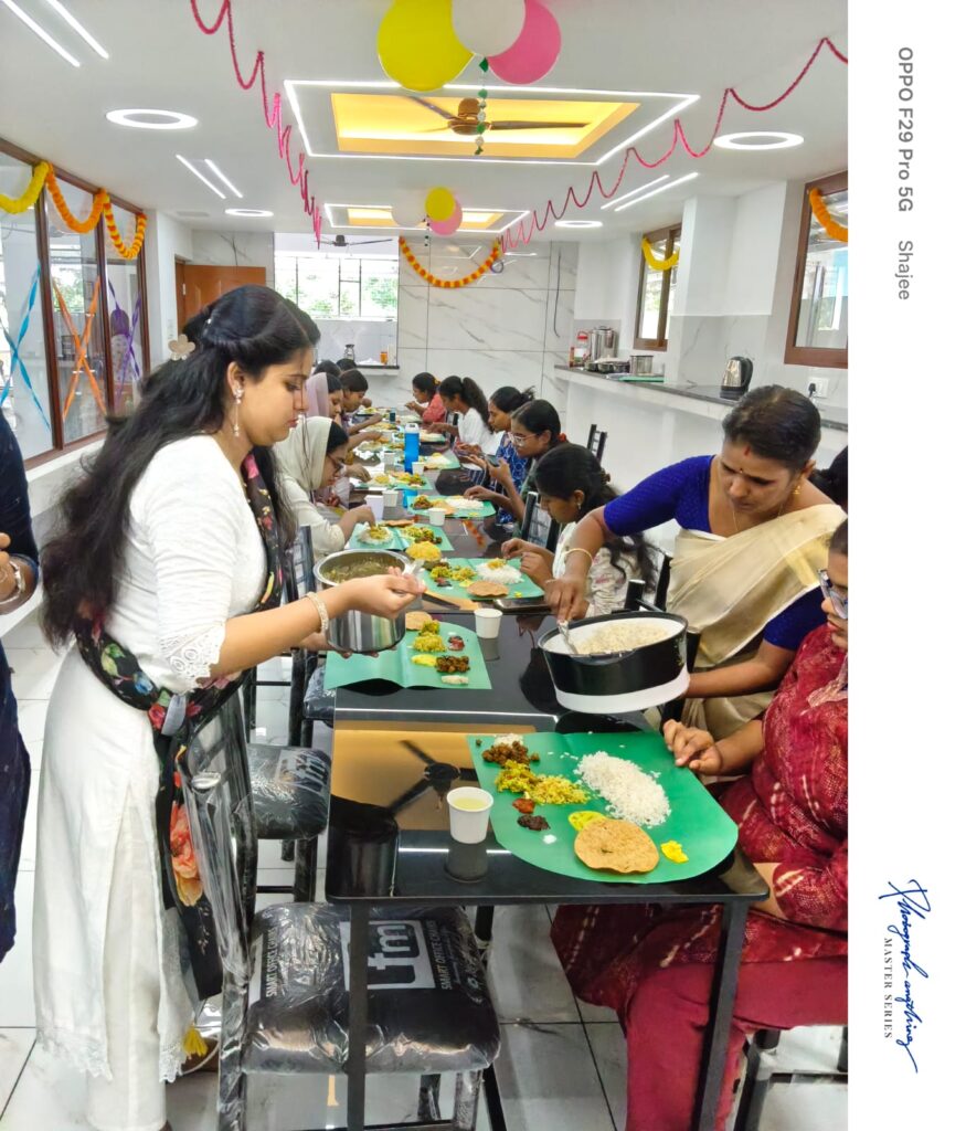 Residents enjoying a grand Onam Sadhya at Amelia Ladies Hostel, showcasing Kerala’s traditional festival culture.